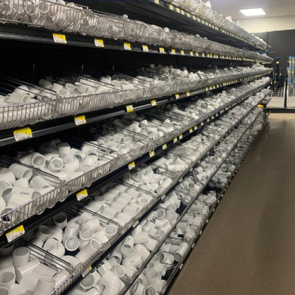 Plumbing SuppliesPVC pipes and fittings on display inside of Blakeney Hardware.